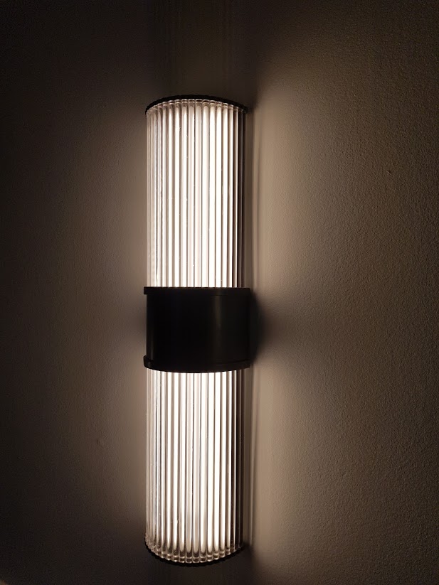 Reeded glass wall light
